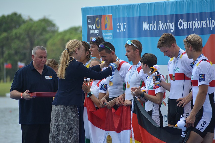 The Hungarian team accepts gold medals after winning the Men's Coxed Pair competition.