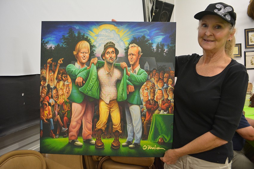 East County's Nancy Loschen bought a print during the tournament auction.