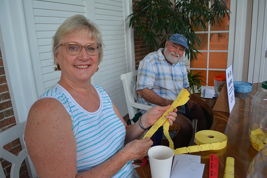 Terri Reynolds and Jeff Reynolds sell 50/50 tickets before the tournament.