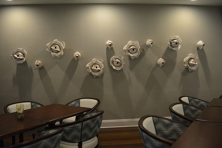 The sitting area near the bar offers a touch to Rosedale's history with glass mounted roses for decor.
