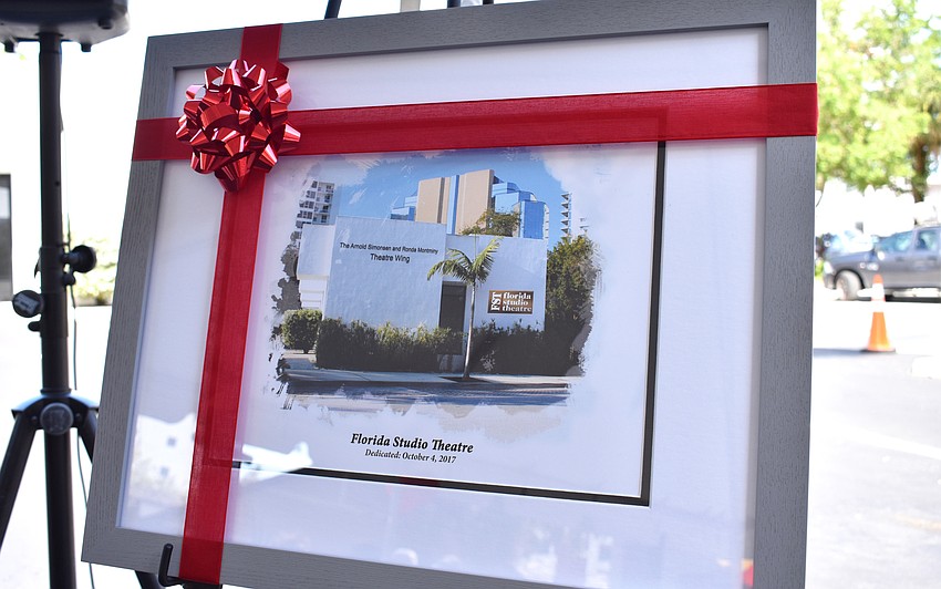 Florida Studio Theatre awarded Arnold Simonsen and Ronda Montminy with this print of the theatre wing they donated $1 million to.