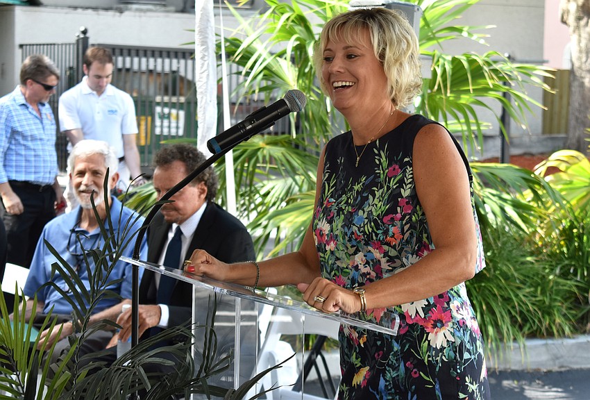 Managing Director Rebecca Hopkins laughs as she welcomes guests.