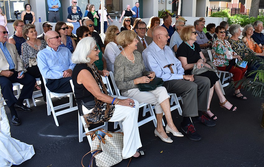 Guests laugh during the dedication ceremony of the Arnold Simonsen and Ronda Montminy Theatre Wing.