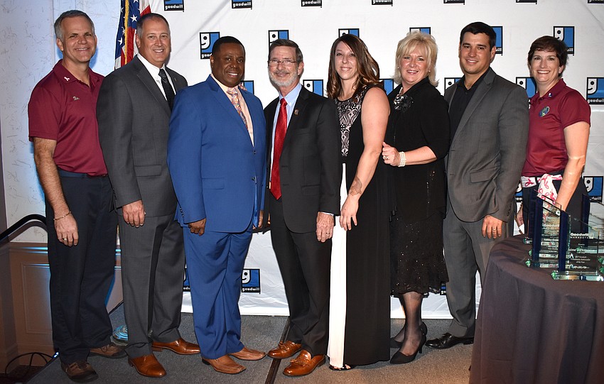 Honorees Tim Holliday, Sheriff Tom Knight, Nate Jacobs, Goodwill Manasota President and CEO Bob Rosinsky, Ashley Anderson, Maribeth Phillips, Bill Sterbinsky and Cynthia Holliday