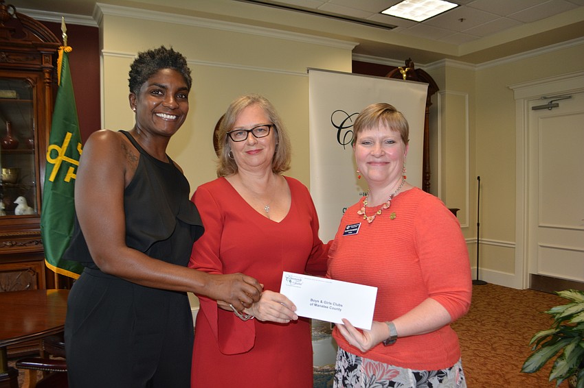 The Community Foundation's Julie Smith (center) presents a check for $2,500 to Boys and Girls Club of Manatee's Catrese Estes and Dawn Stanhope.