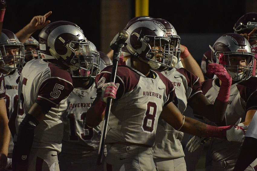 Senior defensive back Jamar Johnson (8) holds a sledgehammer as he leads the team in pregame rituals.