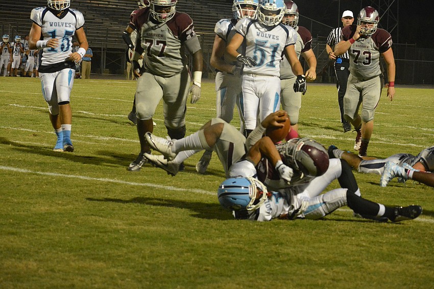 Ali Boyce falls on a defender and into the end zone.