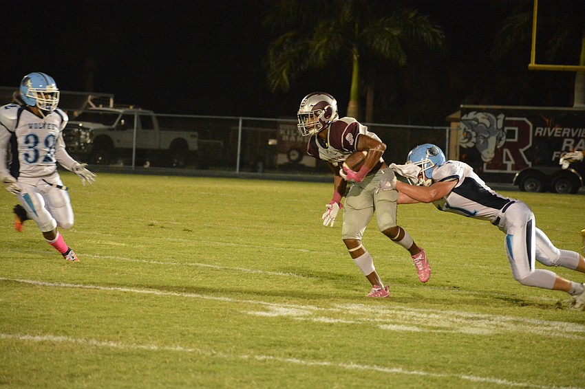 Jamar Johnson evades a tackle on a punt return.