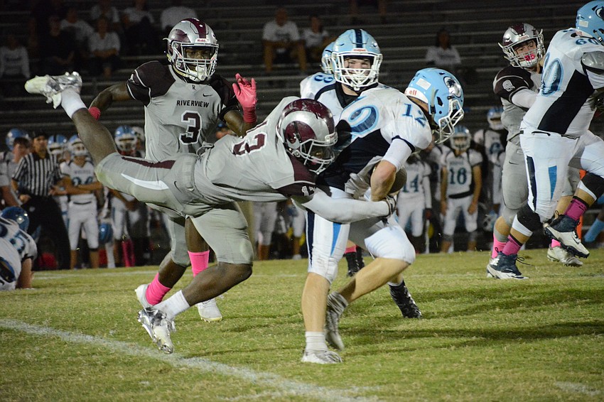 Junior defensive lineman Jamaris Palmore flies through the air to sack a Newsome quarterback.