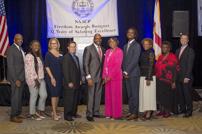 Sarasota NAACP President Trevor D. Harvey (center) stands for a photo with honorees of the 32nd Annual Freedom Awards.