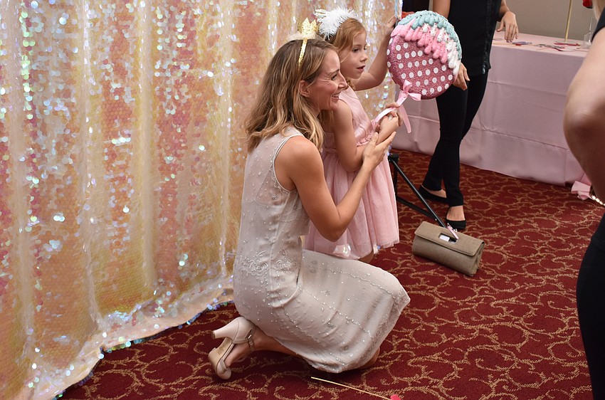 Liz and Mila Sandburg pose in the photobooth at Tea and Tutus on Oct. 7 at the FSU Center for the Performing Arts.