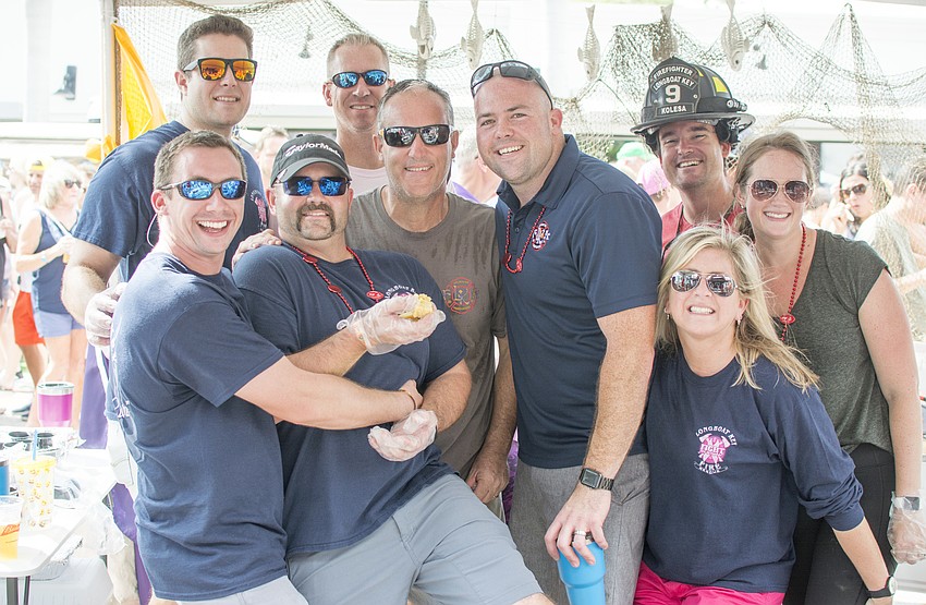 Members of the Longboat Key Fire Department and volunteers pose during the Morton's 18th Annual Firehouse Chili Cook-off. The department took second place in the competition.