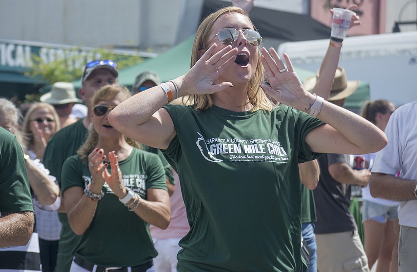 Sarasota County Sheriff's Office Community Affairs Director Kaitlyn Perez cheers for judge Sarasota Sheriff Tom Knight.
