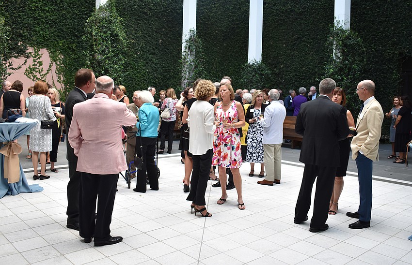 Guests mingle during the reception in the Turrell Skyspace courtyard at the Circle Member Preview Dinner on Oct. 11 at The Ringling.