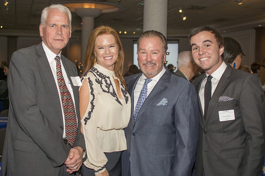 Master of Ceremonies Dan Bailey with Terri, Michael and Max Klauber