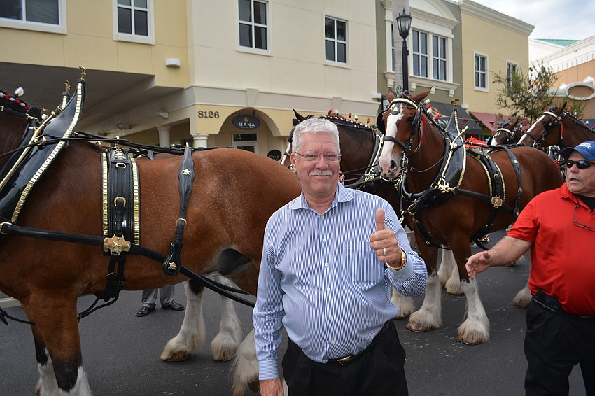 Vanessa Fine Jewelry owner Don Baugh came out of his business to enjoy the excitement.