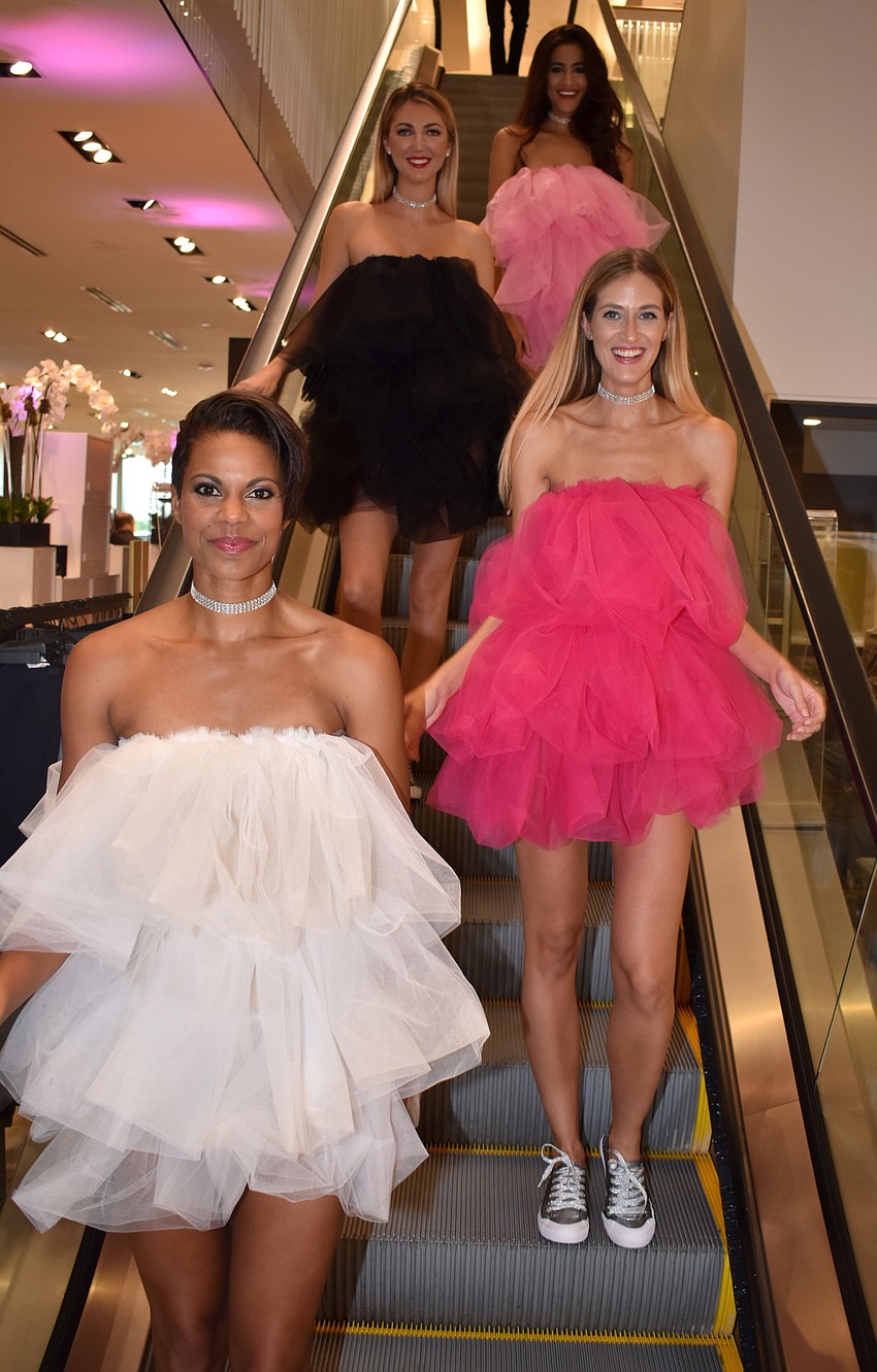 Models head to the first floor to encourage guests to participate in the raffle at Key to the Cure on Oct. 12 at Saks Fifth Avenue.