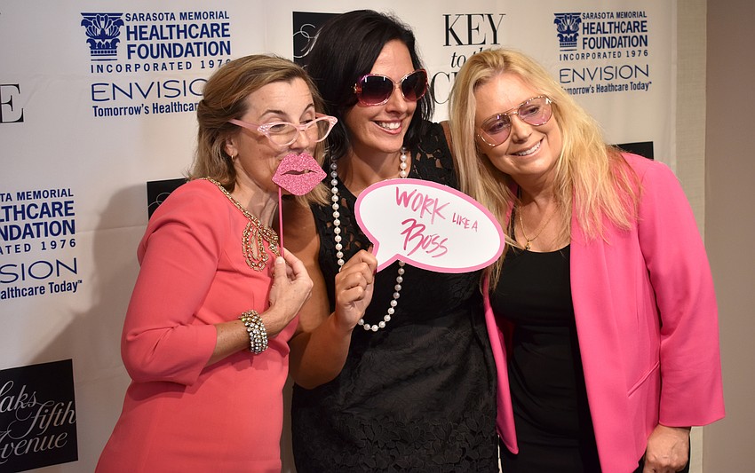Kimberley Payne, Jennifer Niedzinski and Erica Muncy pose in the photo booth at Key to the Cure on Oct. 12 at Saks Fifth Avenue.