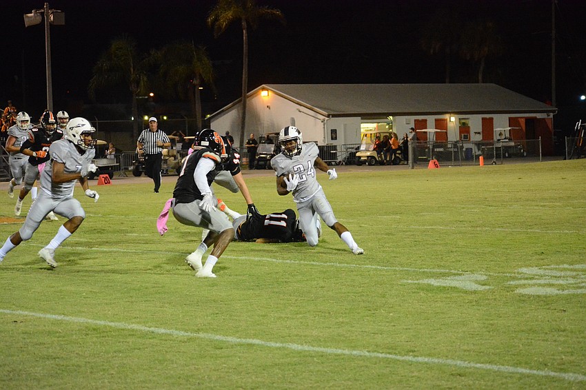 Braden River junior Camaron White cuts upfield against Sarasota.