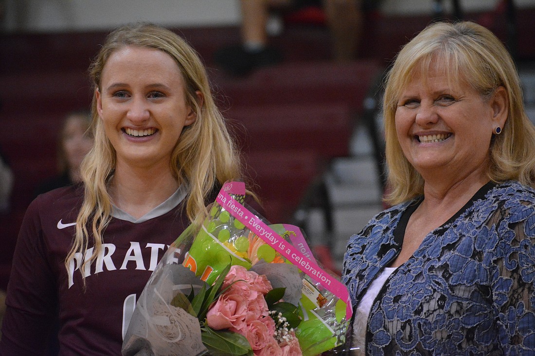 Sydney Jaco and Wynna Jaco stand together on Braden River volleyball Senior Night. There has always been a Jaco on the Pirates volleyball team.