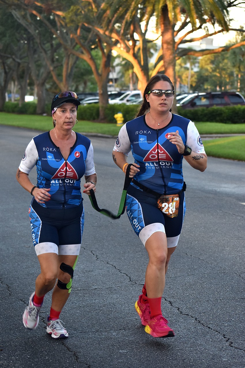 Triathletes makes their way around the running course at The Resort at Longboat Key Club.