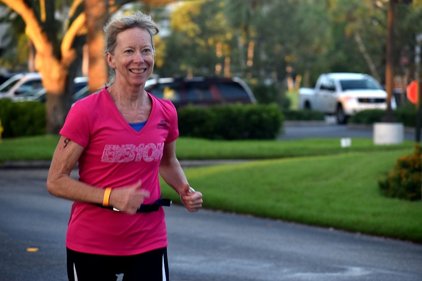 Missy Carrier is all smiles during the first running leg of the duathlon.