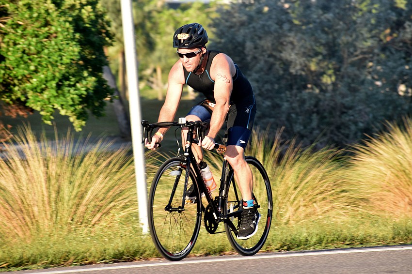Eric Putnal races down Gulf of Mexico Drive during the Longboat Key Triathlon.