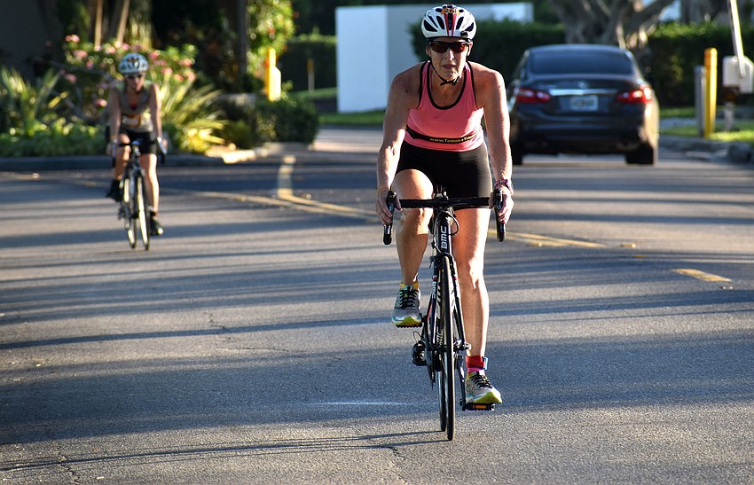 Bikers make their way back to The Resort at Longboat Key Club to transition into the final running leg of the race.