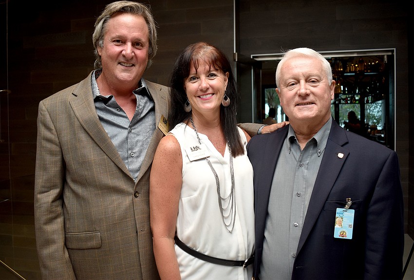 Longboat Key Chamber of Commerce Chairman Mike Doll, Tammy Halsted and John Wojtyna