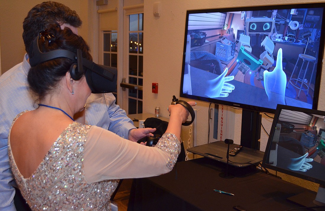 Elena Williams tries a virtual reality simulation at An Evening at the Avant-Garde on March 18 at Ringling College of Art and Design.