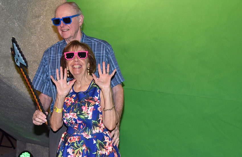 Pat and Greg Reinhart take a turn in the photo booth at First Night RIAF 2017 on Oct. 18 at The Ringling.