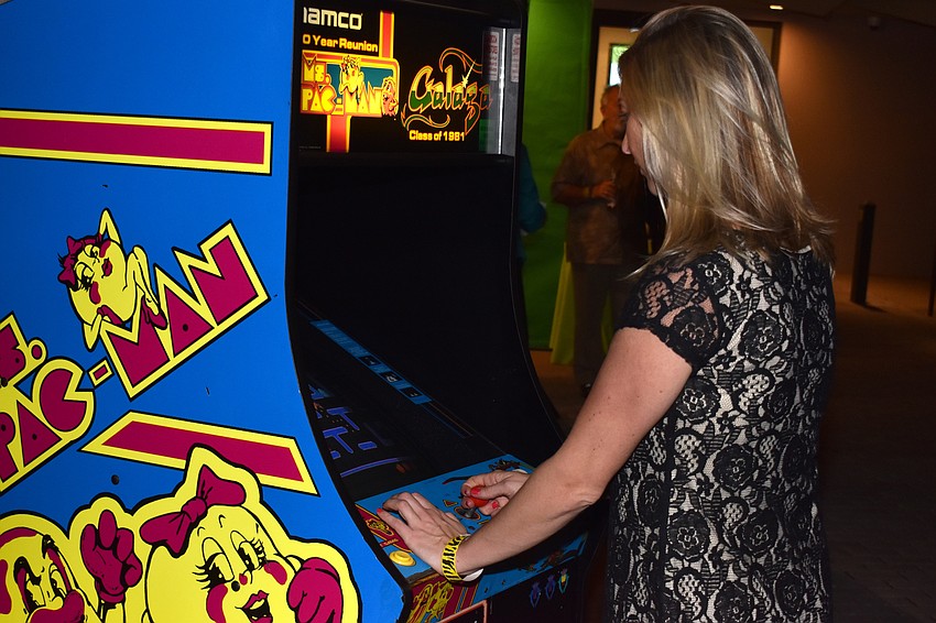 Amy Donnellan plays a game of Pac-Man at First Night RIAF 2017 on Oct. 18 at The Ringling.