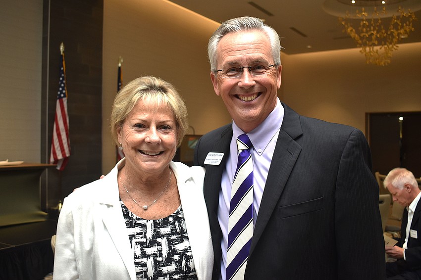 Longboat Key Chamber of Commerce President Gail Loefgren and supporting sponsor Michael Vejins of Raymond James Financial