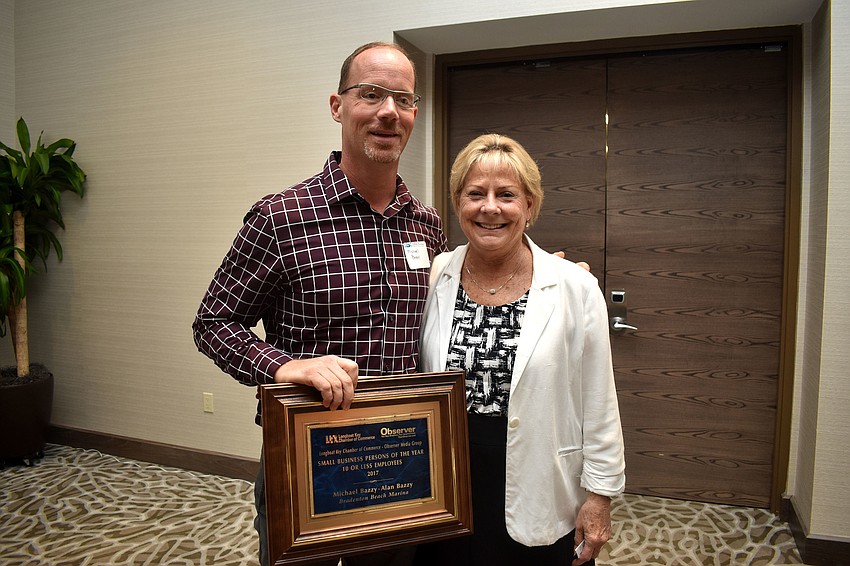 Small Businessperson of the Year 10 or fewer employees winner Michael Bazzy of Bradenton Beach Marina and Chamber President Gail Loefgren