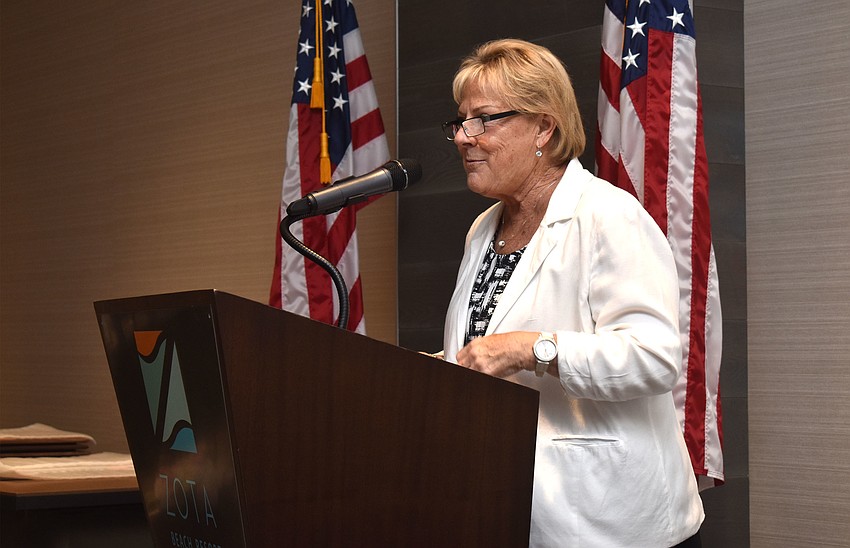 Chamber President Gail Loefgren welcomes the 106 attendees to the awards luncheon.