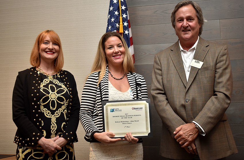 Observer Publisher Emily Walsh, second place winner of Rookie Small Businessperson of the year Robyne Richardson of Beach Fitness and Chamber Chairman Michael Doll