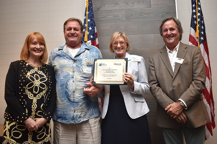 Observer Publisher Emily Walsh, third place winners of Small Businessperson of the Year 11 to 100 employees Harry and Lynn Christensen of Harry’s Continental Kitchens and chamber chairman Michael Doll