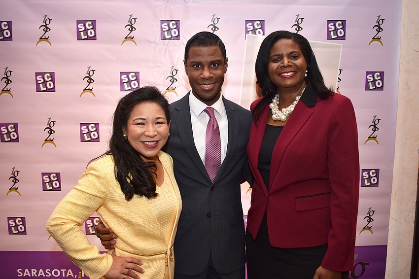 Honoree Lee-En Chung with emcee Justin Mosely and honoree Valerie Powell-Stafford