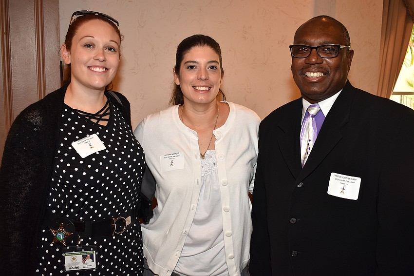 Amber Haller, Autumn Reppolo and Pastor John Walker