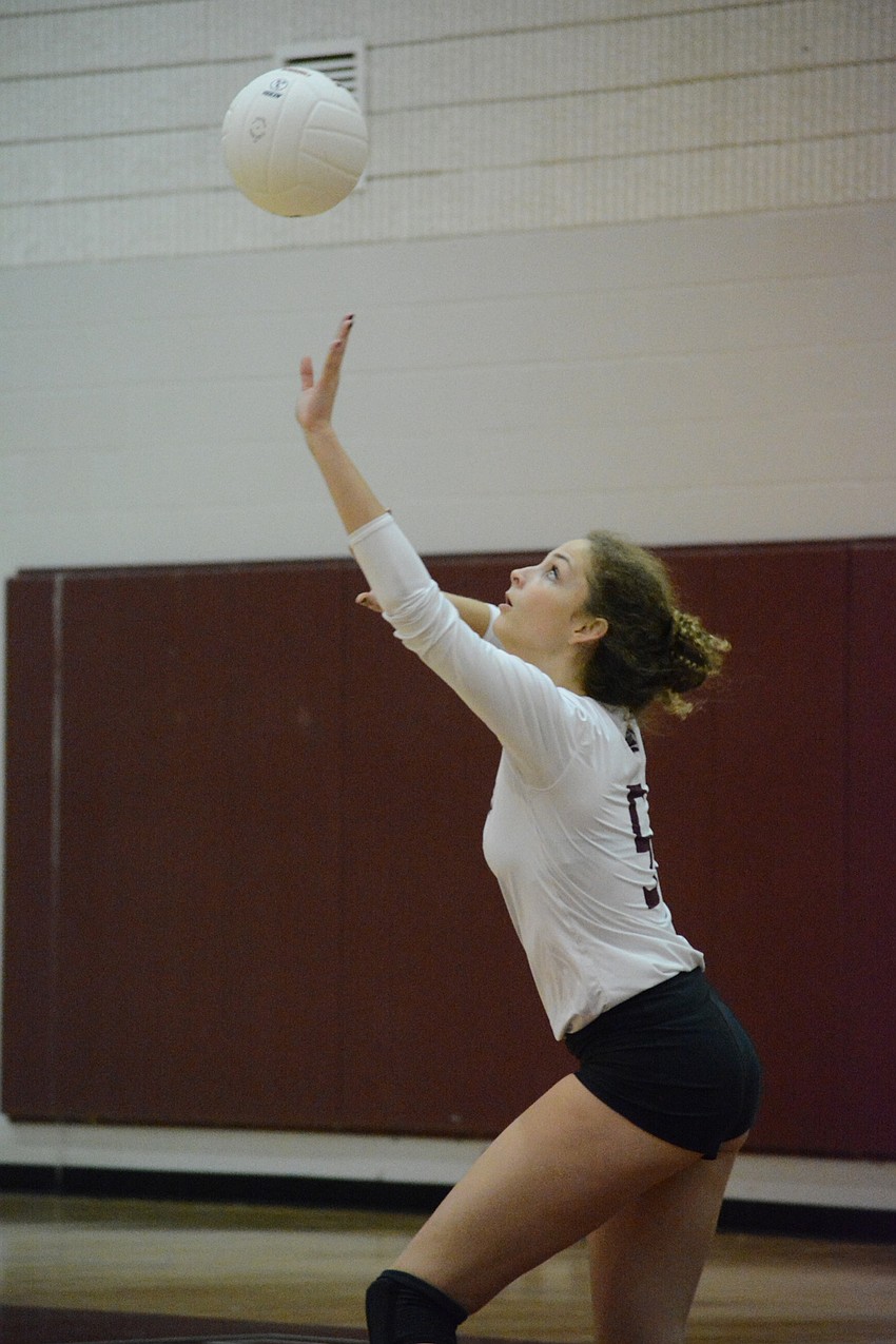 Riah Walker serves against Newsome. The sophomore Walker had four aces in the win.