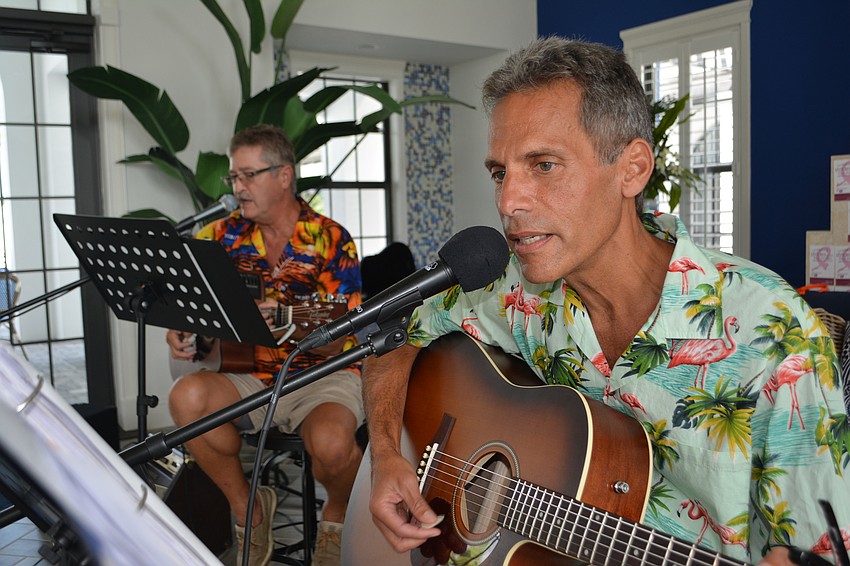 Since all three play guitar, Tom Perillo, right with Bill Irvan in the back, kind of acts as the organizer.