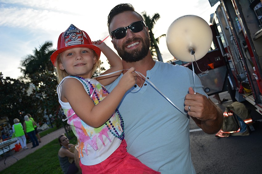 John and Chloe Chirgwin, new homeowners in Lakewood Ranch, check out an East Manatee Fire Rescue District firetruck.
