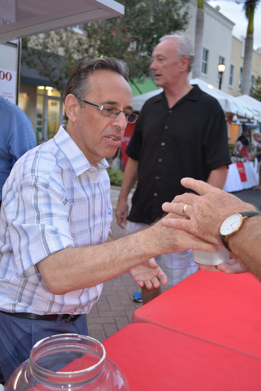 David Grace serves up beer on behalf of the Lakewood Ranch Business Allliance.