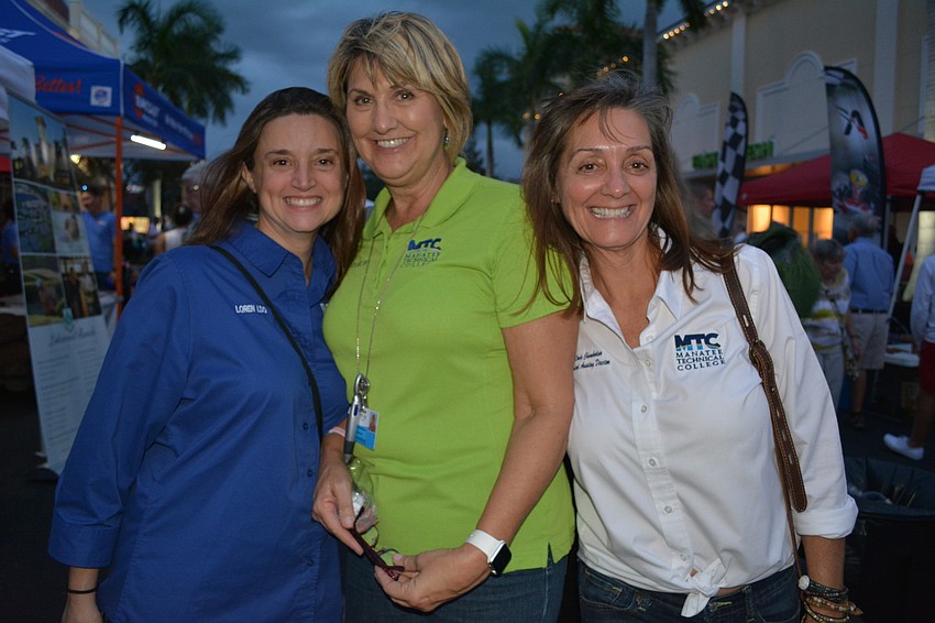 Manatee Technical College's Loren Hutchison, Kathy Matthews and Linda Chamberlain manned MTC's vendor booth before checking out the rest of the Block Party.