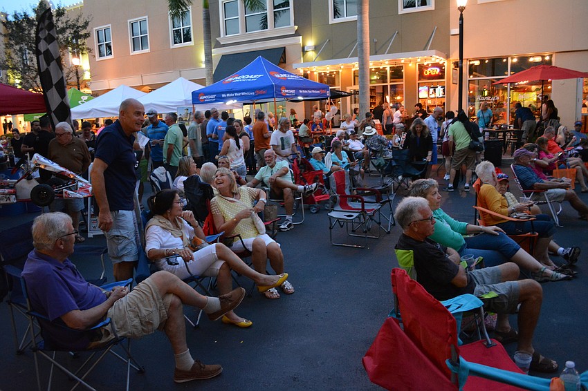 Block Party attendees gathered to hear live music by Doug Deming & the Jewel Tones.