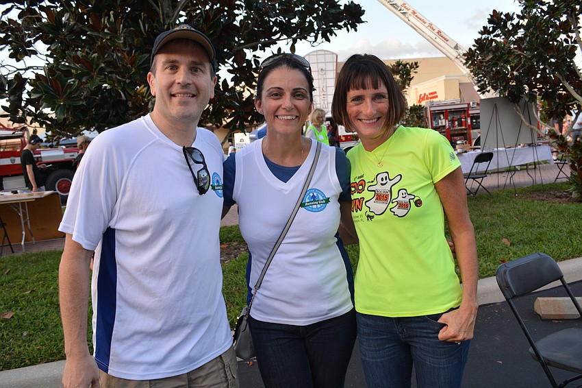 Members of the Lakewood Ranch Running Club — Mike Brady, Sharon Smyth and Jen Tullio — promote their club and upcoming Boo Run at Club Day.