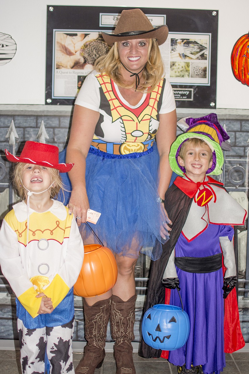 Scarlett, Cassie and Preston Hafner dressed up as Jessie, Woody and Zurg for Mote's Night of Fish, Fun and Fright.