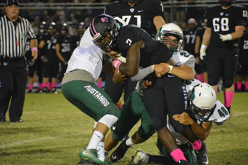 The Pirates' DeShaun Fenwick runs through a host of Lakewood Ranch tacklers.