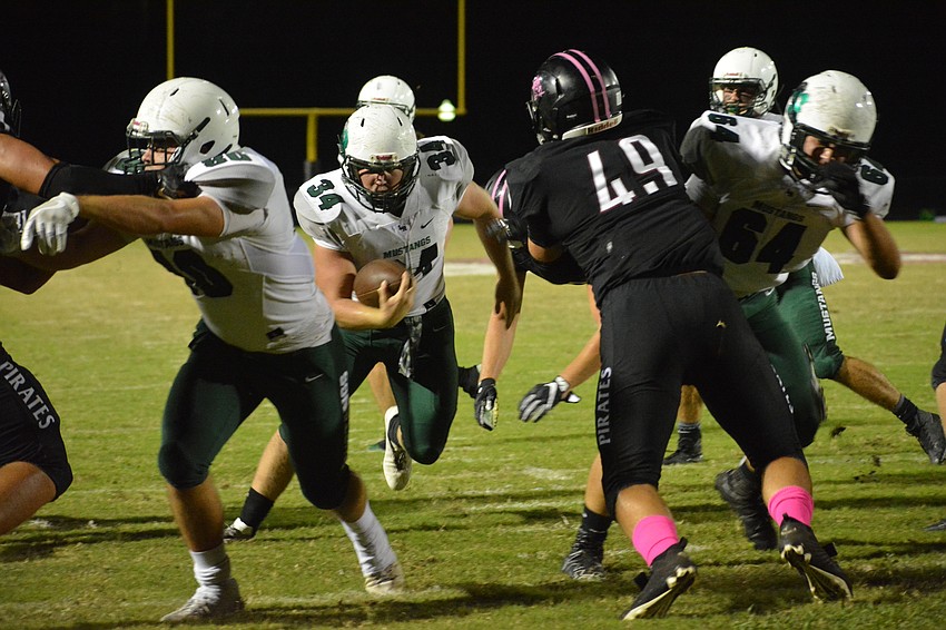 Lakewood Ranch running back Chase Sharp barrels through the heart of the Pirates defense. The run resulted in a touchdown.