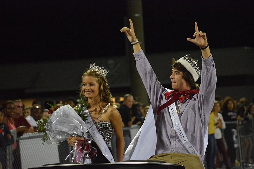Braden River senior Homecoming Queen  and King, Britney Phillips and Kyle Goda, ride around the track at halftime.